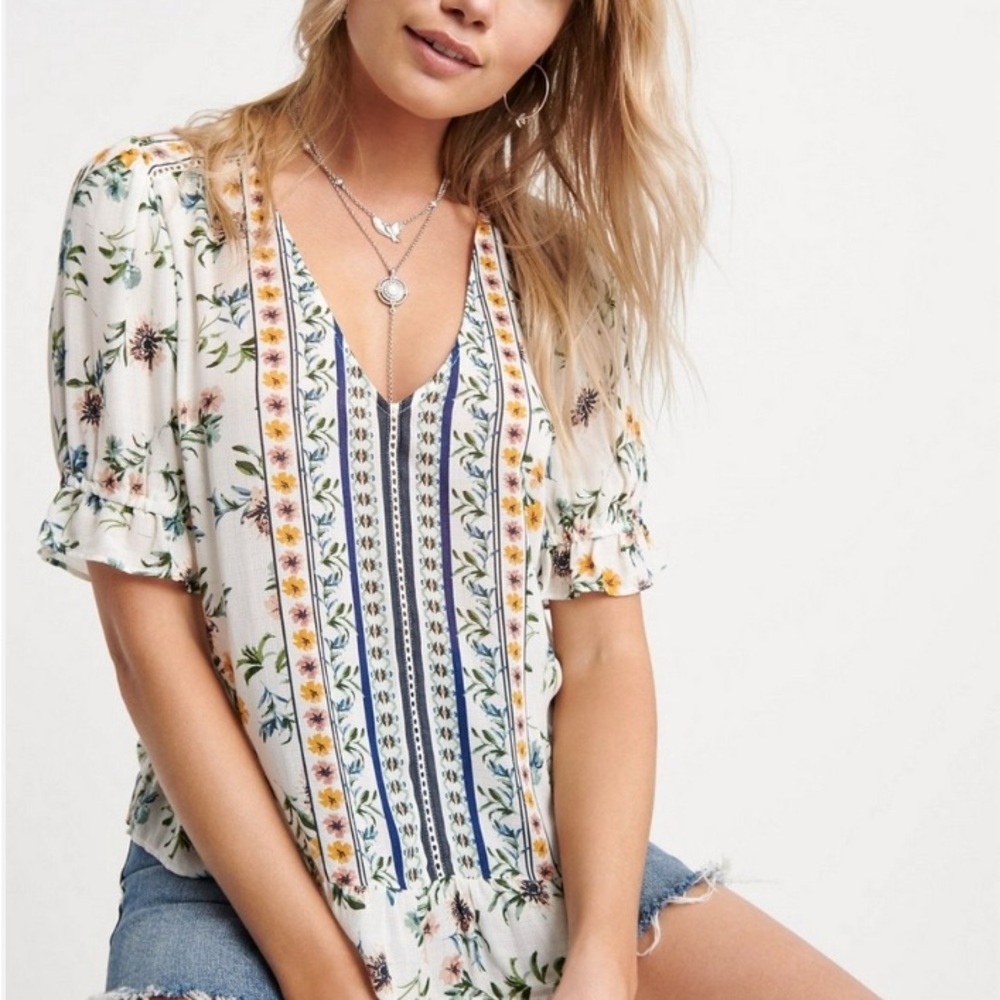 Lucky Brand. Delicate top with ruffle hems and floral prints, a romantic look.